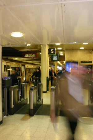People going through ticket barriers in Charing Cross
