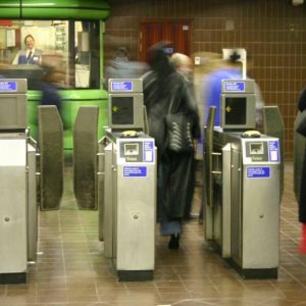 People going through ticket barriers on the Tube