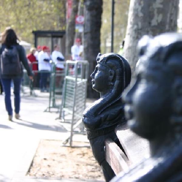 Statuettes on bench arms