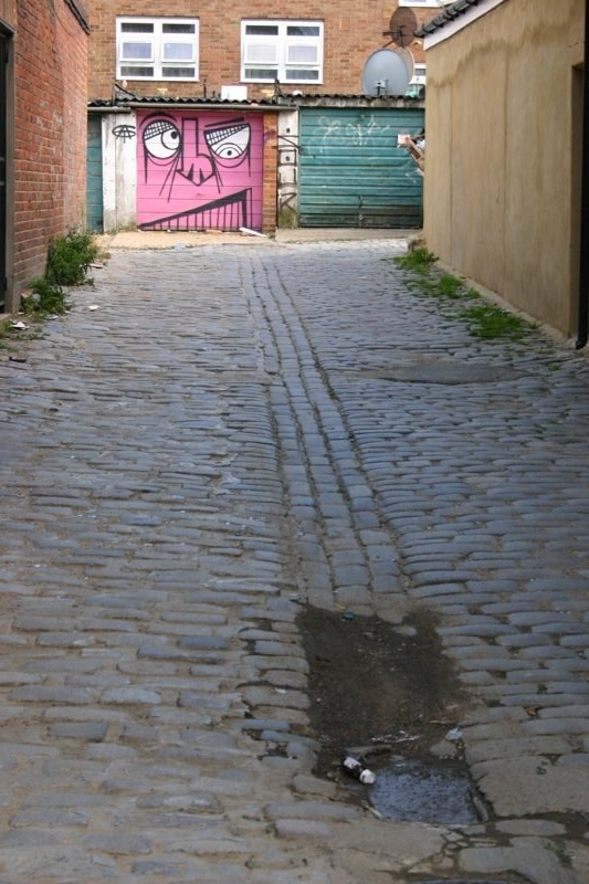 Grinning down the alley