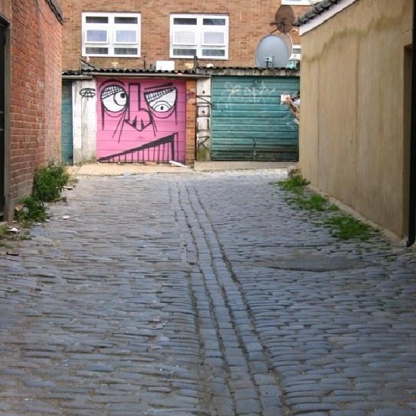 Grinning down the alley