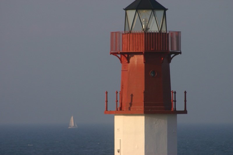 Lighthouse and yacht