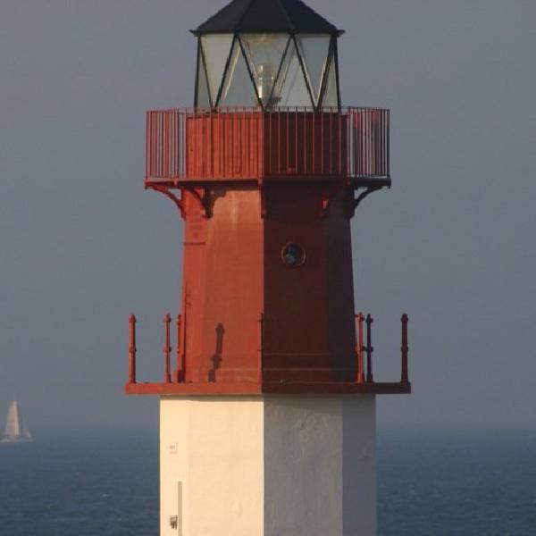 Lighthouse and yacht