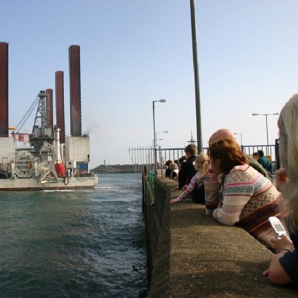Onlookers watch Mayflower Resolution leave Douglas