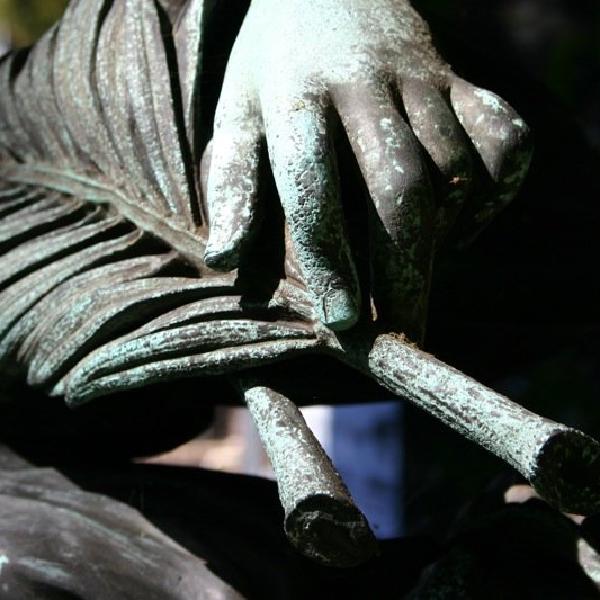Holding a bronze leaf