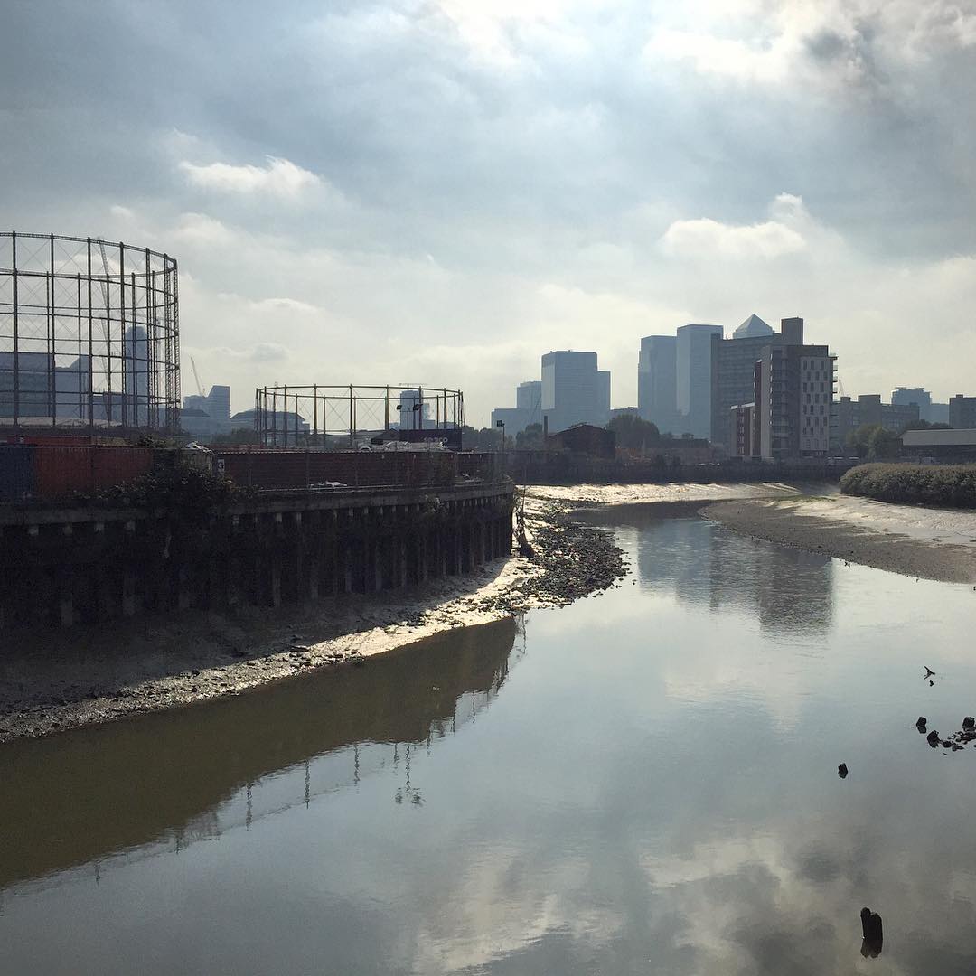 Looking along the River Lea from gasometers to Canary Wharf