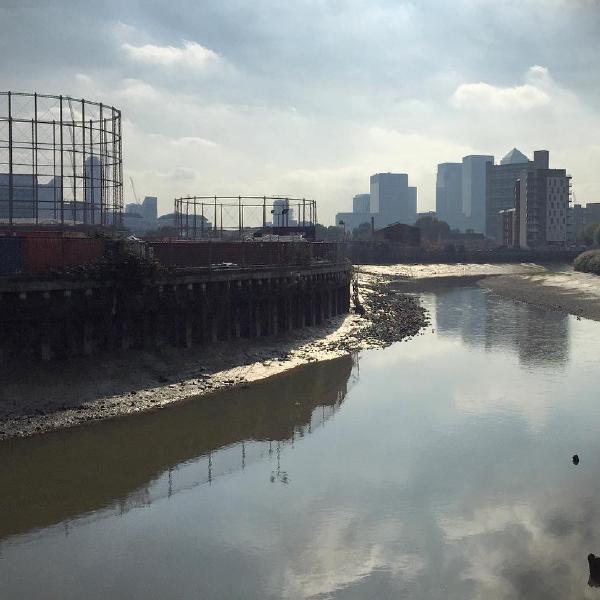 Looking along the River Lea from gasometers to Canary Wharf